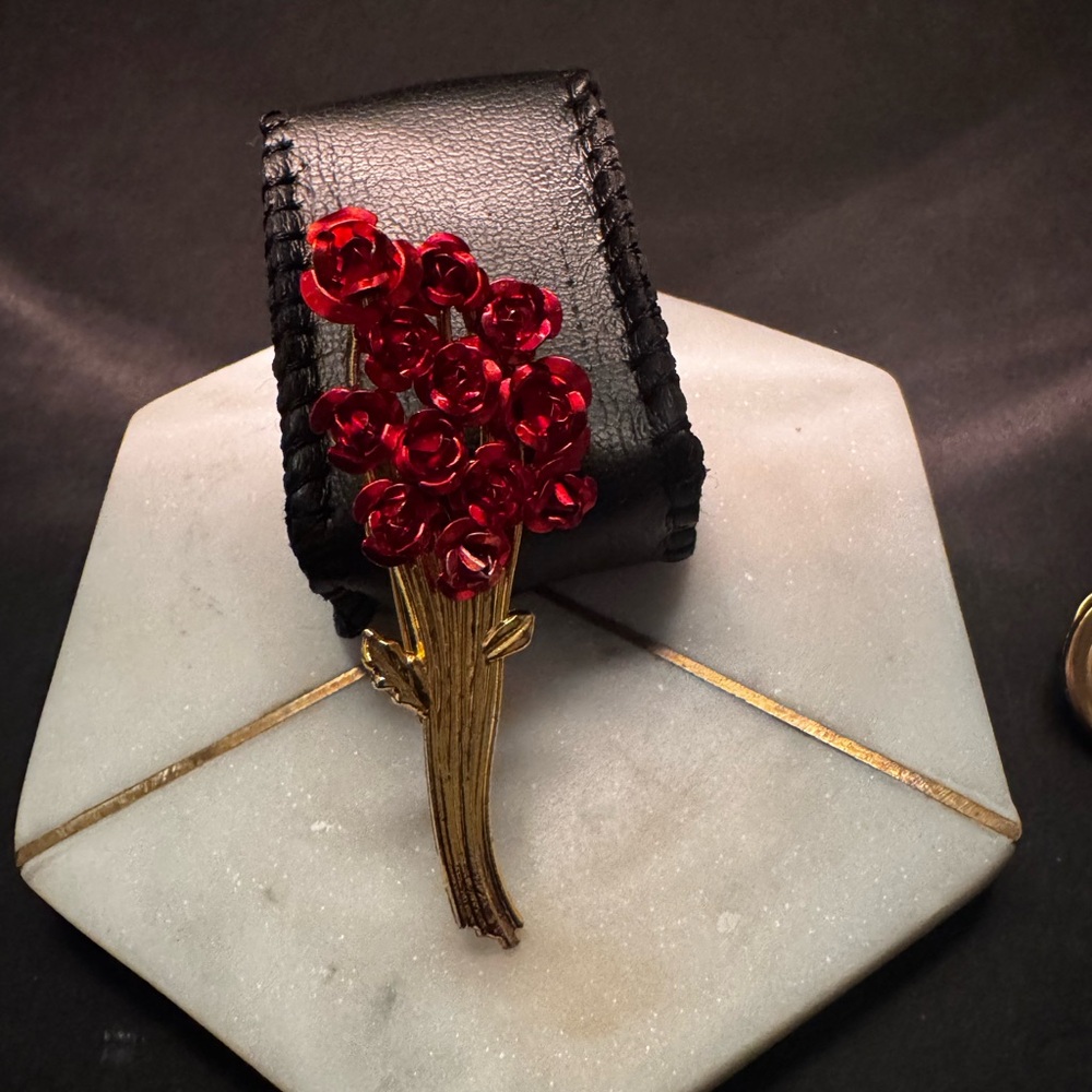 Elegant Black Bracelet with Red Floral Design